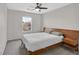 Neutral bedroom with bed, side tables and view from the window at 9221 Steeltree St, Las Vegas, NV 89143