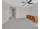 Spacious bedroom features neutral carpet, a ceiling fan, and a large storage console at 9221 Steeltree St, Las Vegas, NV 89143