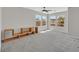 Large bedroom features three large windows, neutral carpet and a stylish media center at 9221 Steeltree St, Las Vegas, NV 89143