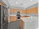 Bright kitchen features modern stainless steel appliances, granite countertops and a large basin sink at 9221 Steeltree St, Las Vegas, NV 89143