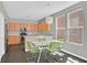 Charming kitchen with wooden cabinetry, stainless steel appliances, and a cozy breakfast nook with modern lighting at 9221 Steeltree St, Las Vegas, NV 89143