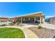 Wide shot of the covered patio showcasing a stone walkway and various seating arrangements at 9511 Star Vista Ct, Las Vegas, NV 89149