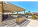 Backyard features extended covered patio, built-in grill and a swimming pool with a waterfall at 9511 Star Vista Ct, Las Vegas, NV 89149