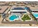 Aerial view of private backyard featuring a pool, spa, and playset at 9511 Star Vista Ct, Las Vegas, NV 89149