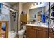 Bathroom features a stand up shower, wood vanity, and great lighting at 9511 Star Vista Ct, Las Vegas, NV 89149