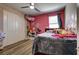 Bright bedroom featuring ample storage with closet and modern ceiling fan at 9511 Star Vista Ct, Las Vegas, NV 89149