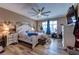 Large bedroom with a ceiling fan, exercise bikes, and natural light at 9511 Star Vista Ct, Las Vegas, NV 89149