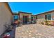 Charming courtyard entrance with brick pavers and outdoor seating at 9511 Star Vista Ct, Las Vegas, NV 89149