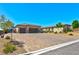 Stunning single story home featuring a three car garage and beautiful desert landscaping at 9511 Star Vista Ct, Las Vegas, NV 89149