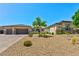 Charming single-story home with well-maintained desert landscaping and a three car garage at 9511 Star Vista Ct, Las Vegas, NV 89149