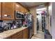 Functional kitchen space with modern appliances and a connecting laundry room at 9511 Star Vista Ct, Las Vegas, NV 89149