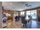 Open kitchen and dining area featuring a granite island, stainless steel appliances, and a bright, airy ambiance at 9511 Star Vista Ct, Las Vegas, NV 89149