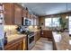 Modern kitchen with granite countertops, stainless steel appliances, and ample storage space for culinary enthusiasts at 9511 Star Vista Ct, Las Vegas, NV 89149