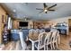 Open living area with hardwood floors, a dining table, and comfortable seating, ideal for Gathering gatherings at 9511 Star Vista Ct, Las Vegas, NV 89149