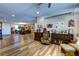 Open floor plan living room with hardwood floors, ample natural light, and comfortable furniture at 9511 Star Vista Ct, Las Vegas, NV 89149