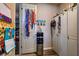 A functional mud room features storage cabinets, a water dispenser, and wall decorations to provide household convenience at 9511 Star Vista Ct, Las Vegas, NV 89149