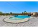 Beautiful pool with a water slide, waterfall features, and a relaxing spa surrounded by a stone patio at 9511 Star Vista Ct, Las Vegas, NV 89149