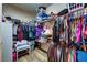 Walk-in closet with custom shelving and hanging rods designed to maximize space for clothes and storage at 9511 Star Vista Ct, Las Vegas, NV 89149