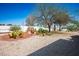 Spacious backyard with desert landscaping and a hammock at 9536 Ruby Hills Dr, Las Vegas, NV 89134