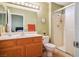 Well-maintained bathroom with vanity, sink, toilet, and walk-in shower with glass door at 9536 Ruby Hills Dr, Las Vegas, NV 89134