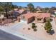 Charming single-story home with a well-manicured front yard, desert landscaping, and a two-car garage at 9536 Ruby Hills Dr, Las Vegas, NV 89134