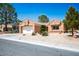 Charming single-story home featuring a two-car garage, low-maintenance landscaping, and a welcoming entrance at 9536 Ruby Hills Dr, Las Vegas, NV 89134