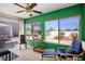 Relaxing sun room with tile floors, large windows, and a comfortable seating arrangement at 9536 Ruby Hills Dr, Las Vegas, NV 89134