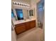 Spacious bathroom with a double vanity, tiled floor, and a bathtub-shower combo at 10516 Angel Dreams Ave, Las Vegas, NV 89144