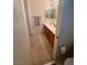 Practical bathroom with a double sink vanity, carpeted floor, and a towel bar at 10516 Angel Dreams Ave, Las Vegas, NV 89144