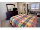 Comfortable bedroom with mirrored closet and dresser at 10516 Angel Dreams Ave, Las Vegas, NV 89144