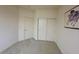 Neutral bedroom features carpeted flooring, standard closet, and simple wall art at 10516 Angel Dreams Ave, Las Vegas, NV 89144
