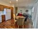Charming dining area with wood floors adjacent to the kitchen at 10516 Angel Dreams Ave, Las Vegas, NV 89144