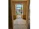 Enclosed front porch with decorative metal gate and concrete flooring at 10516 Angel Dreams Ave, Las Vegas, NV 89144