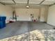This is a two car garage with standard garage door, lighting and concrete floor at 10516 Angel Dreams Ave, Las Vegas, NV 89144