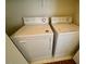 Functional laundry area with a standard white washer and dryer units at 10516 Angel Dreams Ave, Las Vegas, NV 89144