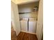 Convenient closet laundry area featuring a washer, dryer, and storage shelf at 10516 Angel Dreams Ave, Las Vegas, NV 89144