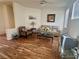 Cozy living room with wood floors and neutral-colored furniture at 10516 Angel Dreams Ave, Las Vegas, NV 89144