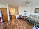Inviting living room with wood floors and view of the entryway at 10516 Angel Dreams Ave, Las Vegas, NV 89144
