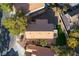 An aerial view displays a Southwestern home with a tile roof and low maintenance landscaping at 1100 Meridian Bay Dr, Las Vegas, NV 89128
