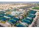 Expansive aerial view showcases the community's recreational facilities, including tennis courts and stadium at 1100 Meridian Bay Dr, Las Vegas, NV 89128