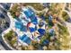 Aerial view of a modern park featuring shaded playground equipment and walking paths at 1100 Meridian Bay Dr, Las Vegas, NV 89128