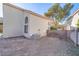 Backyard with partial artificial grass and dirt landscaping at 1100 Meridian Bay Dr, Las Vegas, NV 89128