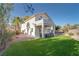 Backyard featuring a patio area, artificial grass, and desert landscaping at 1100 Meridian Bay Dr, Las Vegas, NV 89128