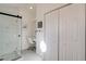 Modern bathroom with marble shower, vanity area, and spacious closet at 1100 Meridian Bay Dr, Las Vegas, NV 89128