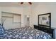 Bedroom with a black dresser, closet, and view of an open door at 1100 Meridian Bay Dr, Las Vegas, NV 89128