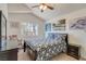 Cozy bedroom with floral bedding, a bright window view and vaulted ceiling at 1100 Meridian Bay Dr, Las Vegas, NV 89128