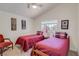 Bright bedroom featuring two twin beds and wall decor at 1100 Meridian Bay Dr, Las Vegas, NV 89128