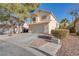 Charming two-story home featuring tile roof, two-car garage, and well-maintained landscaping at 1100 Meridian Bay Dr, Las Vegas, NV 89128