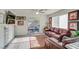 Cozy living room featuring a leather sofa, natural light, and stylish decor at 1100 Meridian Bay Dr, Las Vegas, NV 89128