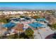 Community park featuring picnic tables with sun shades and a colorful playground for Gathering enjoyment at 1100 Meridian Bay Dr, Las Vegas, NV 89128